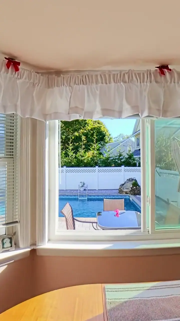 Indoor drone flight from a kitchen out the window to a backyard pool
